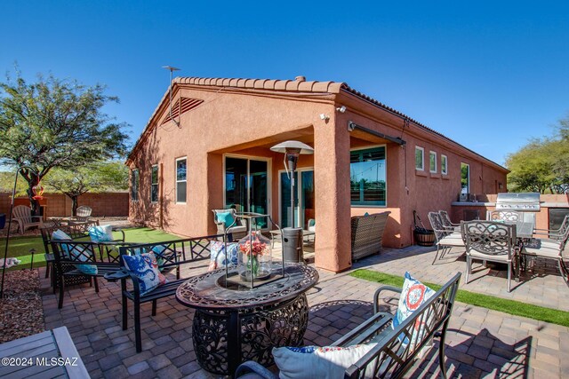 14286 E Lazy Jake Ln, Vail, AZ 85641 - back of property featuring outdoor lounge area and a patio