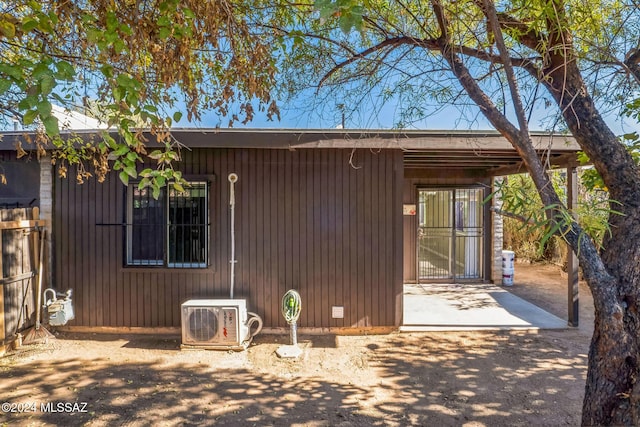 exterior space featuring ac unit and a patio area