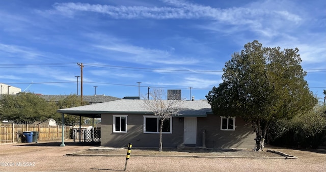 view of front of home with a carport