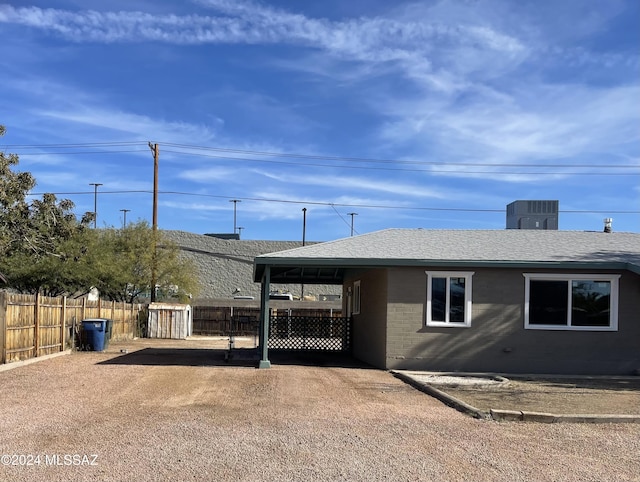 view of property exterior with central AC