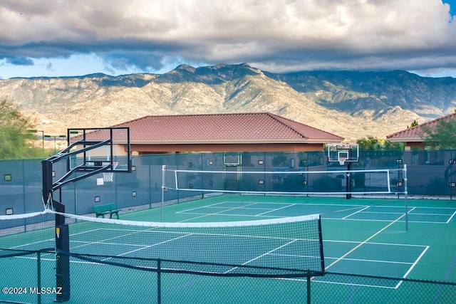 view of sport court with a mountain view