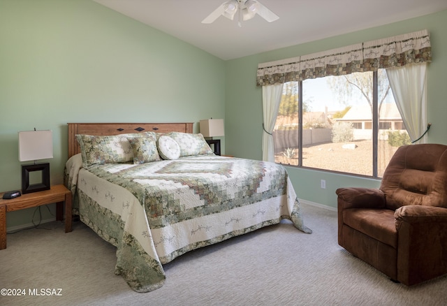 bedroom featuring light carpet, ceiling fan, and lofted ceiling