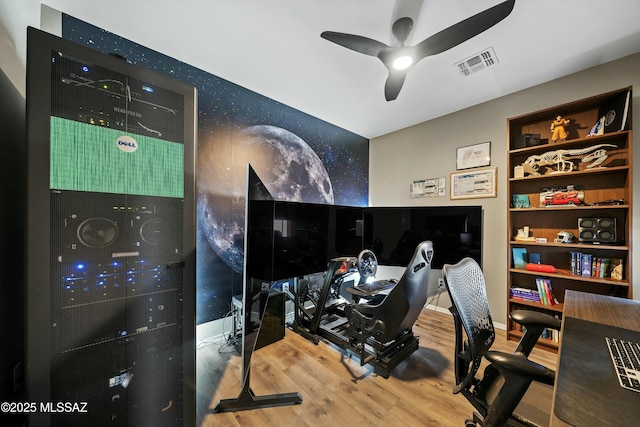 home office with hardwood / wood-style floors and ceiling fan