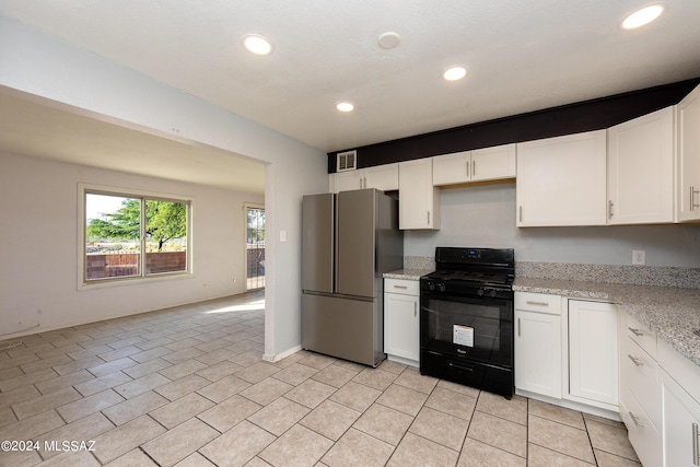 Tucson, AZ 85756 - kitchen with freestanding refrigerator, black range with gas cooktop, white cabinetry, recessed lighting, and light stone counters