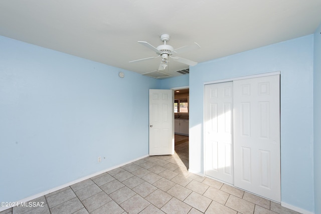 unfurnished bedroom with a closet and ceiling fan