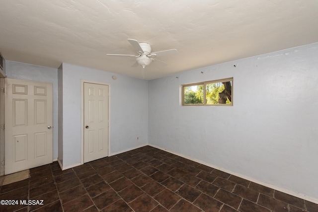 spare room featuring ceiling fan