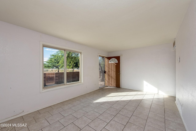 view of tiled spare room