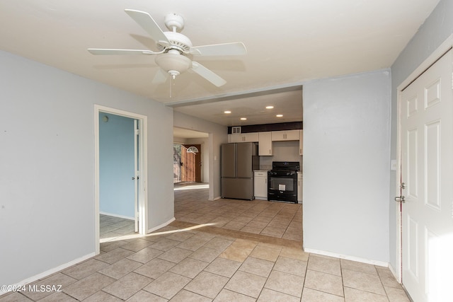 Tucson, AZ 85756 - kitchen featuring black gas stove, freestanding refrigerator, ceiling fan, recessed lighting, and white cabinets