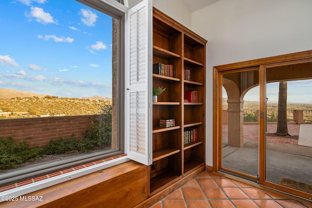 doorway to outside featuring light tile patterned floors