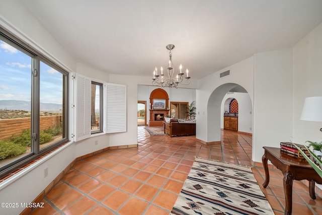 interior space featuring tile patterned floors and an inviting chandelier