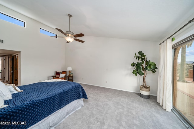 carpeted bedroom featuring ceiling fan and vaulted ceiling