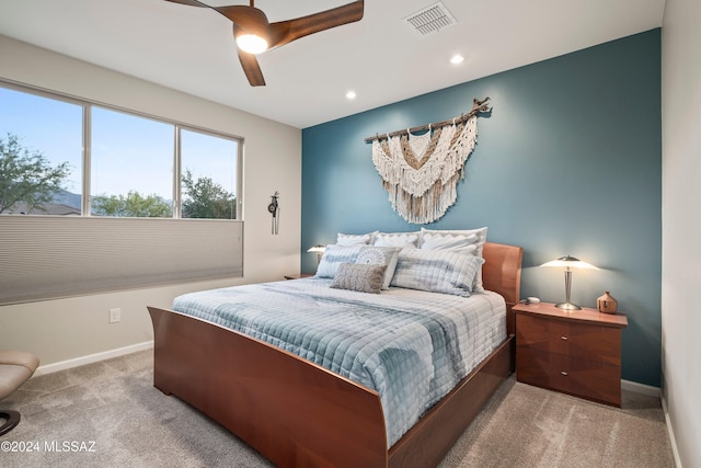 carpeted bedroom featuring ceiling fan