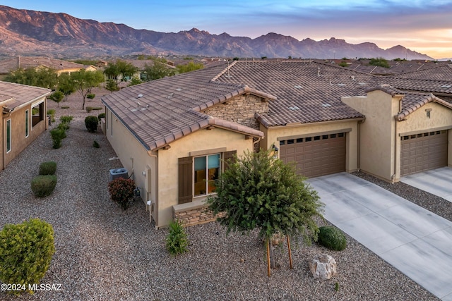 view of front of home featuring a mountain view and a garage