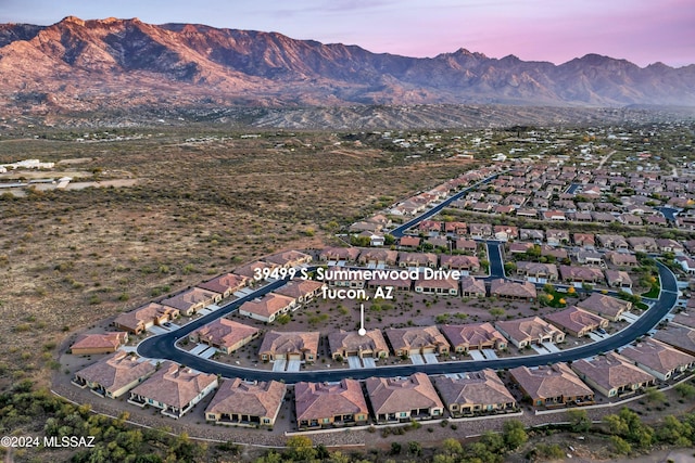 aerial view at dusk with a mountain view