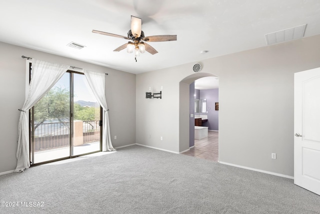 carpeted empty room with ceiling fan