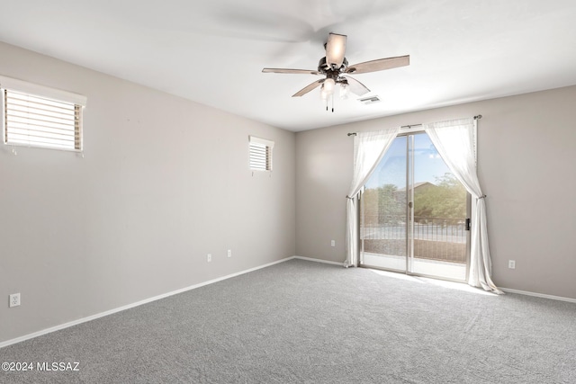 unfurnished room with carpet floors and ceiling fan