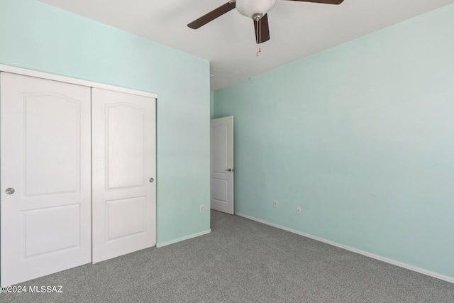 unfurnished bedroom featuring a closet, carpet floors, and ceiling fan