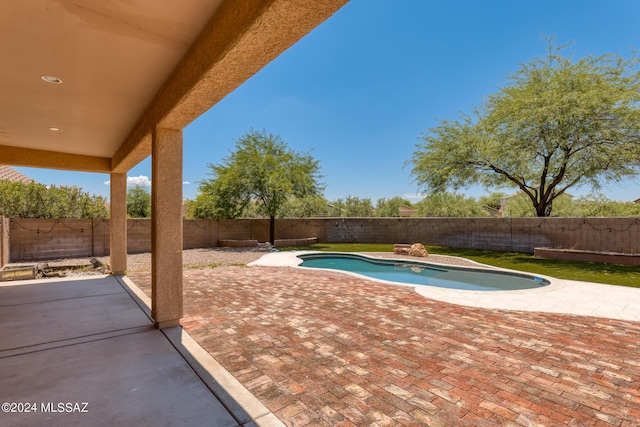 view of swimming pool featuring a patio area