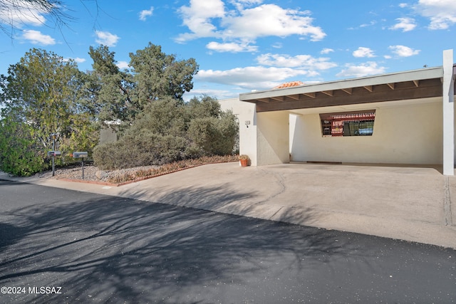 view of home's exterior with a carport