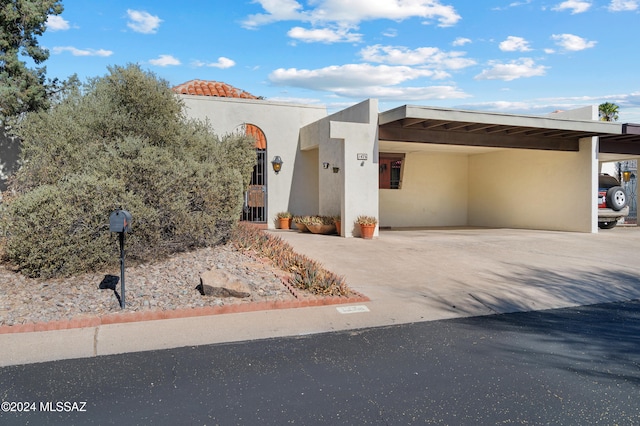 view of front of home with a carport