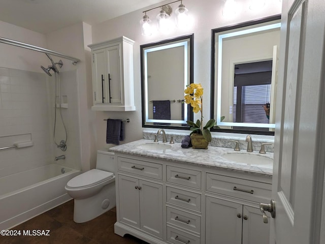 full bathroom with shower / tub combination, vanity, and toilet