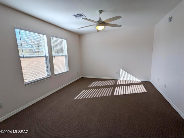 carpeted empty room with ceiling fan