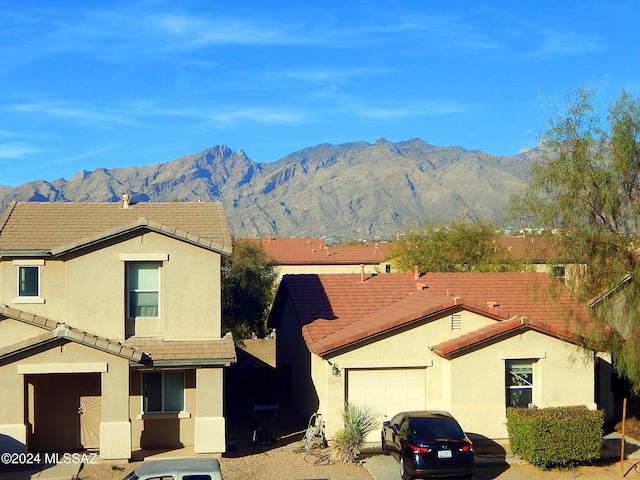 view of front of house with a mountain view and a garage