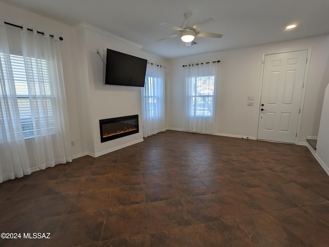 unfurnished living room featuring ceiling fan