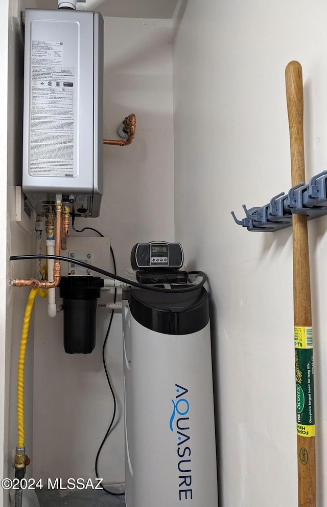 utility room with tankless water heater