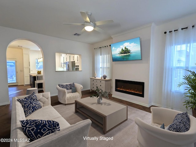 living room featuring light hardwood / wood-style flooring and ceiling fan