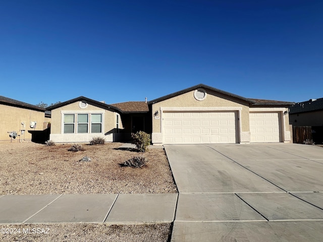 single story home featuring a garage