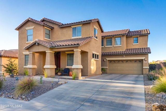 mediterranean / spanish-style home featuring a garage