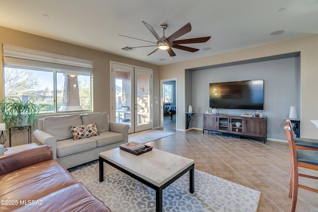 tiled living room with ceiling fan