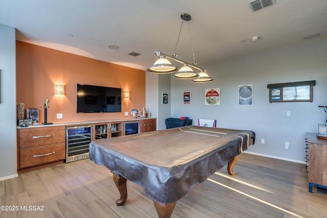 recreation room with light hardwood / wood-style floors, wine cooler, and pool table