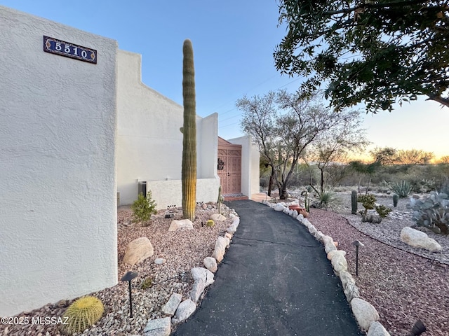 view of property exterior at dusk