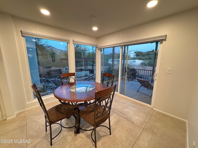 dining area with light tile patterned flooring