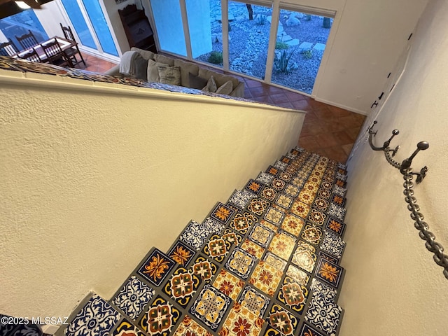 stairs featuring tile patterned floors