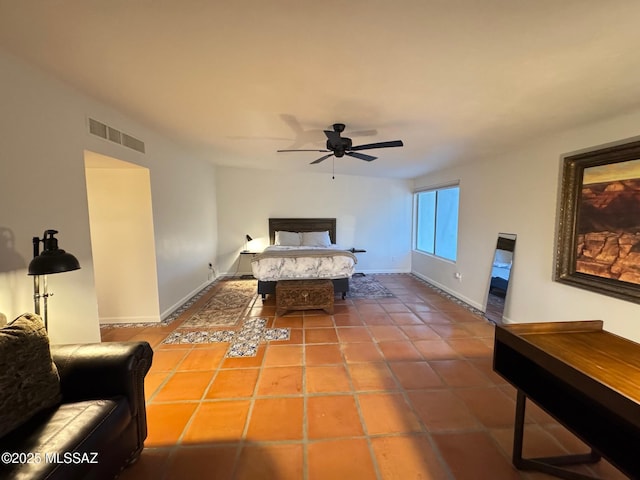 tiled bedroom with ceiling fan