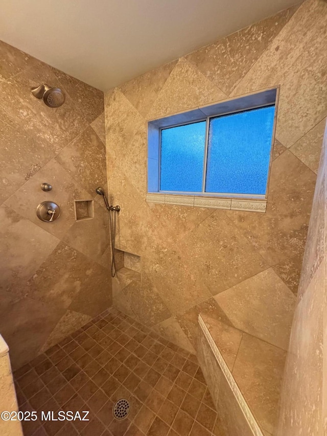 bathroom featuring a tile shower