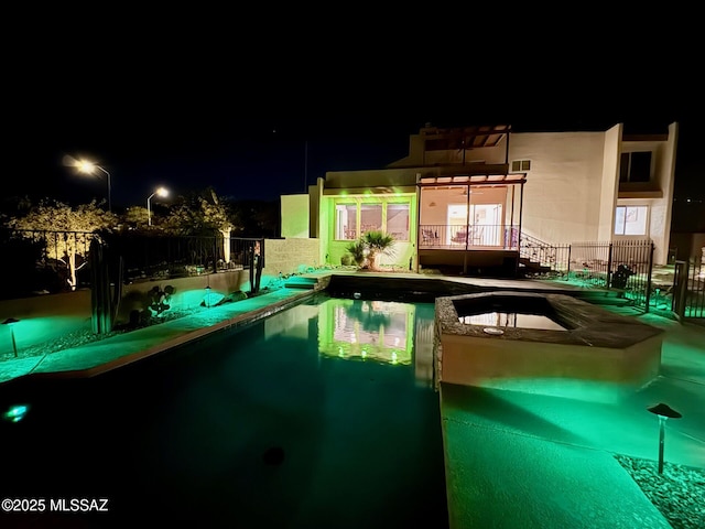 view of pool at night