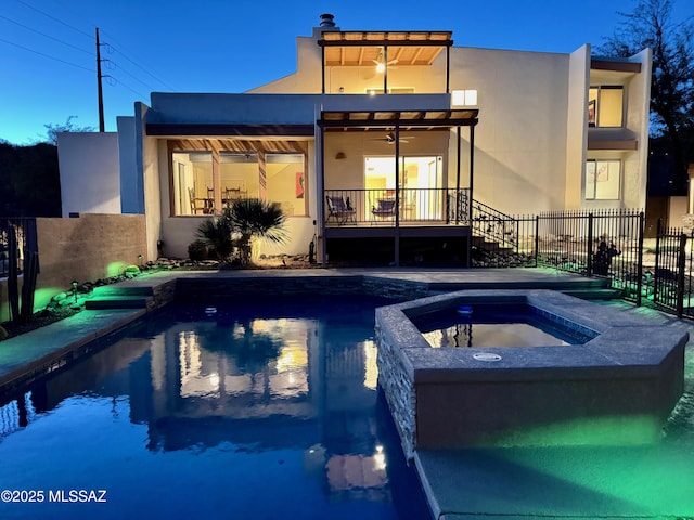 view of pool featuring an in ground hot tub and ceiling fan