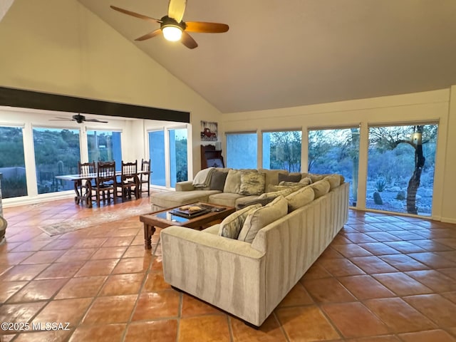 tiled living room with high vaulted ceiling and ceiling fan