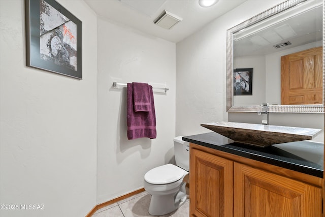 half bathroom featuring toilet, tile patterned flooring, visible vents, and vanity