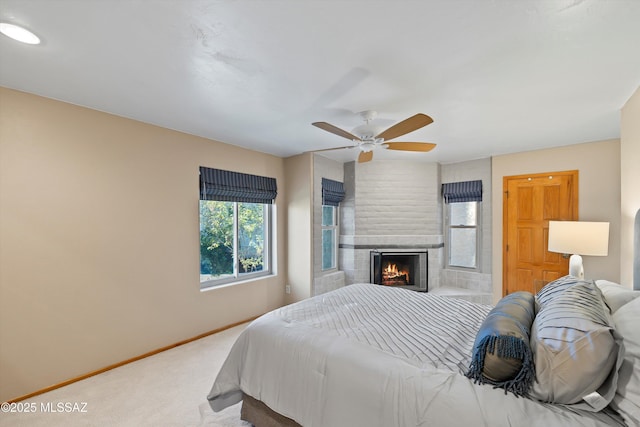 bedroom featuring ceiling fan and carpet