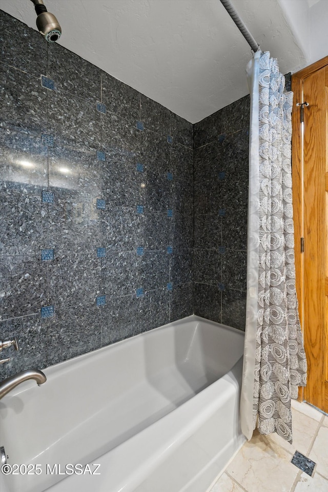 bathroom with shower / bath combo with shower curtain