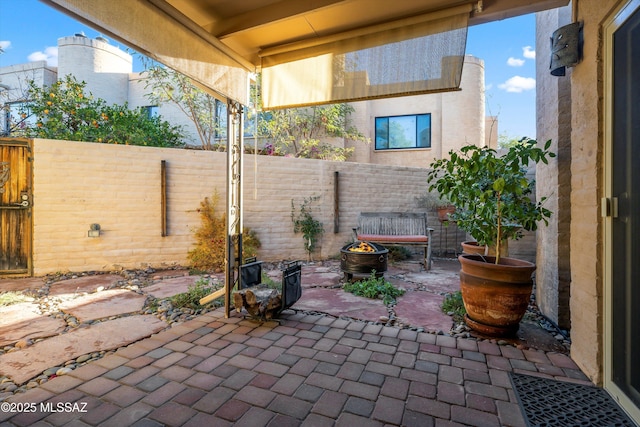 view of patio with a fire pit