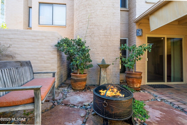 view of patio / terrace featuring a fire pit