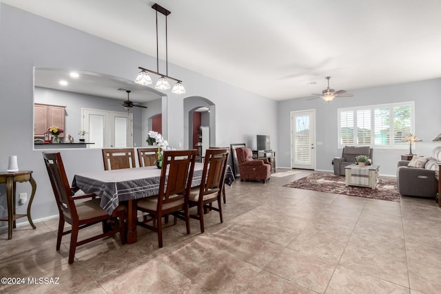 dining space featuring light tile patterned floors and ceiling fan