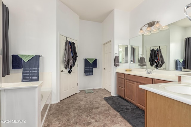 bathroom with vanity and a bathing tub