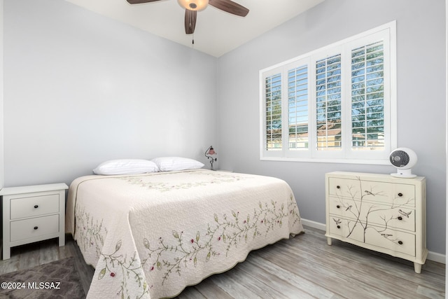 bedroom featuring hardwood / wood-style flooring and ceiling fan